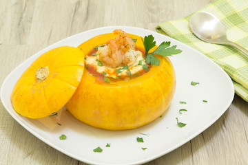 Baked whole pumpkin with shrimp and cheese