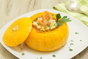 Baked whole pumpkin with shrimp and cheese