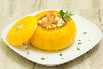 Baked whole pumpkin with shrimp and cheese