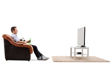 Naklejka premium Man watching football on TV