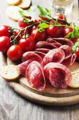Fresh salami with tomato and bread