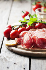 Fresh salami with tomato and bread