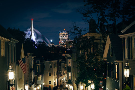 Pleasant Street and the Zakim Bridge in the distance at night, i