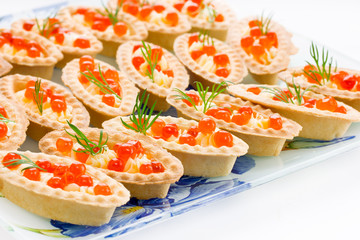 Tartlets with red caviar