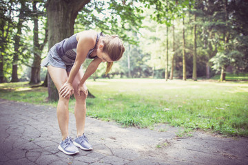 Fitness girl exercising and stretching outdoor