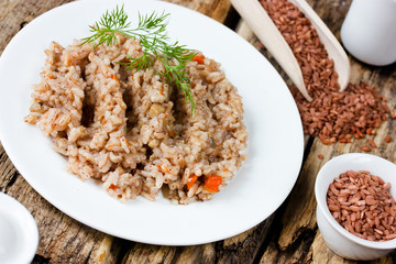 Dish of red rice devzira, dietary pilaf