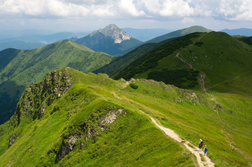 View from Chleb mountain, Velky Rozsutec mountain in the background, Mala Fatra mountain range ( Carpathians ), Slovakia, Europe - beautiful scenery of peaks. Sunny sumer with dramatic clouds.