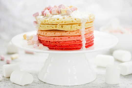 Ombre pancakes with marshmallow sauceon white background