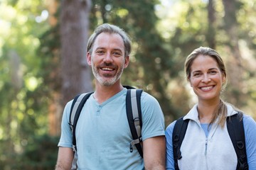 Portrait of hiker couple hiking in forest