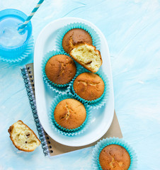 Muffins homemade for dessert with drink on a blue background