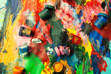 Fototapeta premium Boxes and oil paints multicolored closeup abstract background fr