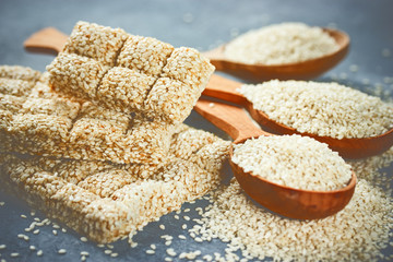 Sesame seeds in wooden spoons and sesame kozinaki