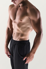 Fototapeta premium Healthy muscular young man posing. Sport portrait. Detail.