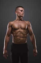 Fototapeta na wymiar Healthy muscular young man posing. Sport portrait.