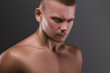 Fototapeta premium Healthy muscular young man. Sport portrait. Emotion.