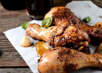 fried chicken legs on a culinary paper. rustic style