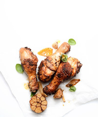 fried chicken legs on a culinary paper. rustic style