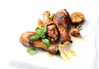 fried chicken legs on a culinary paper. rustic style