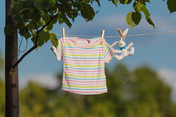 Baby clothes hanging on the clothesline
