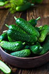 Fresh organic cucumber in ceramic bowl