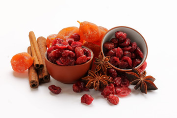 Dried cranberries, kumquat and spices isolated