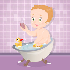 Naklejka premium Cute baby boy smiling while talking a bath in bathroom