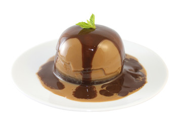 Panna cotta with chocolate sirup and mint