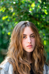Naklejka premium Long haired teenage girl facing the camera