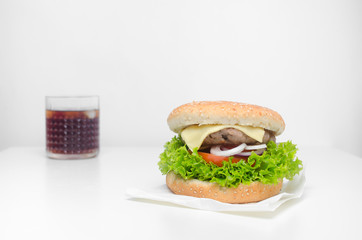 Burger and cola on a white background