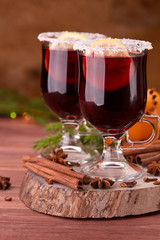 Glasses of mulled wine on wooden table