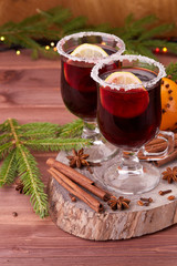 Glasses of mulled wine on wooden table