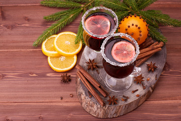 Glasses of mulled wine on wooden table