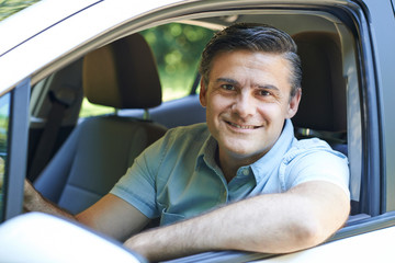 Portrait Of Mature Man Driving Car
