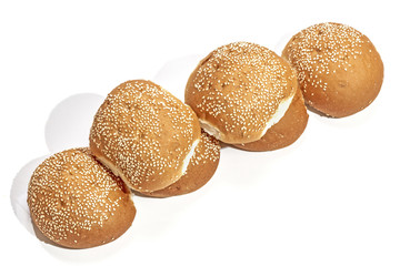 Golden Hamburger Rolls Arranged in Straight Line