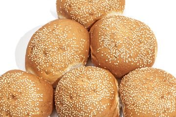 Close Up of Sesame Seed Covered Golden Bread Rolls