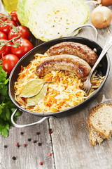 Stewed cabbage with fried sausage