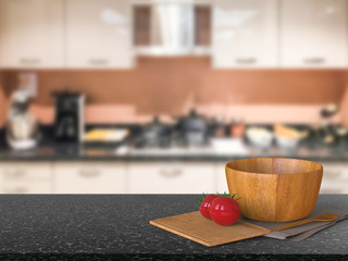 granite counter top with tomato and wooden bowl in kitchen