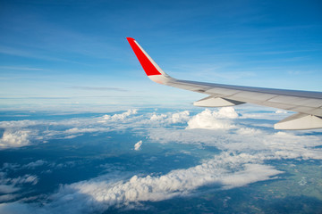 View of clouds and sky from a airplane window