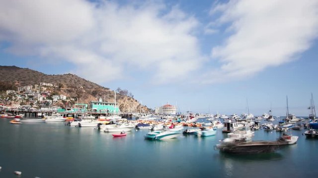 Looking down at the bay and town of Avalon on Catalina Island. Boat fill the harbor. Time Lapse.