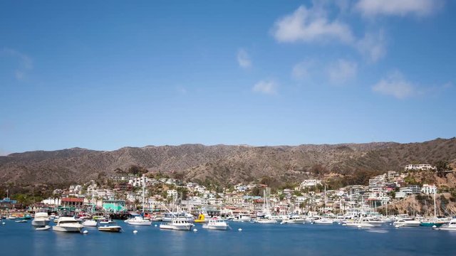 Looking down at the bay and town of Avalon on Catalina Island. Boat fill the harbor. Time Lapse