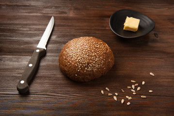 Fresh bread, knife and butter