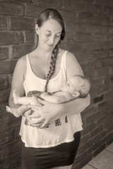 Young Blonde Mother Holding His Newborn Baby Boy, Monochrome Shoot