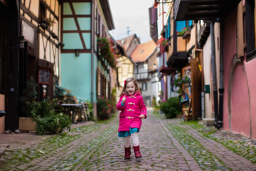 Little girl in historical city center in France