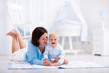 Mother and baby playing on the floor
