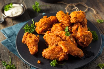 Muurstickers Spicy Deep Fried Breaded Chicken Wings © Brent Hofacker