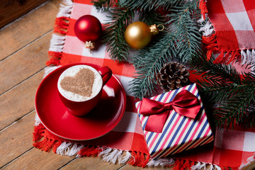 cup of coffee and christmas decorations
