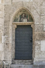 Fototapeta na wymiar Eine Hintertür am Regensburger Dom St. Peter