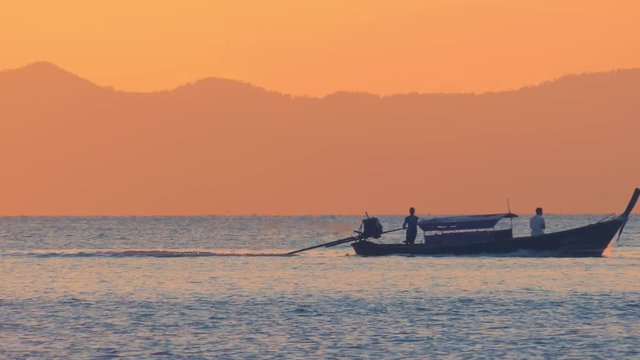 Sea of Thailand travel background. Fishing boat at sunset
