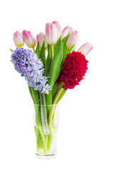 Bouquet of pink tulips and hyacinths in vase isolated over white background 