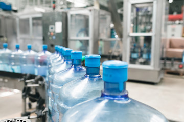 Water factory - Water bottling line for processing and bottling pure spring water into gallons.